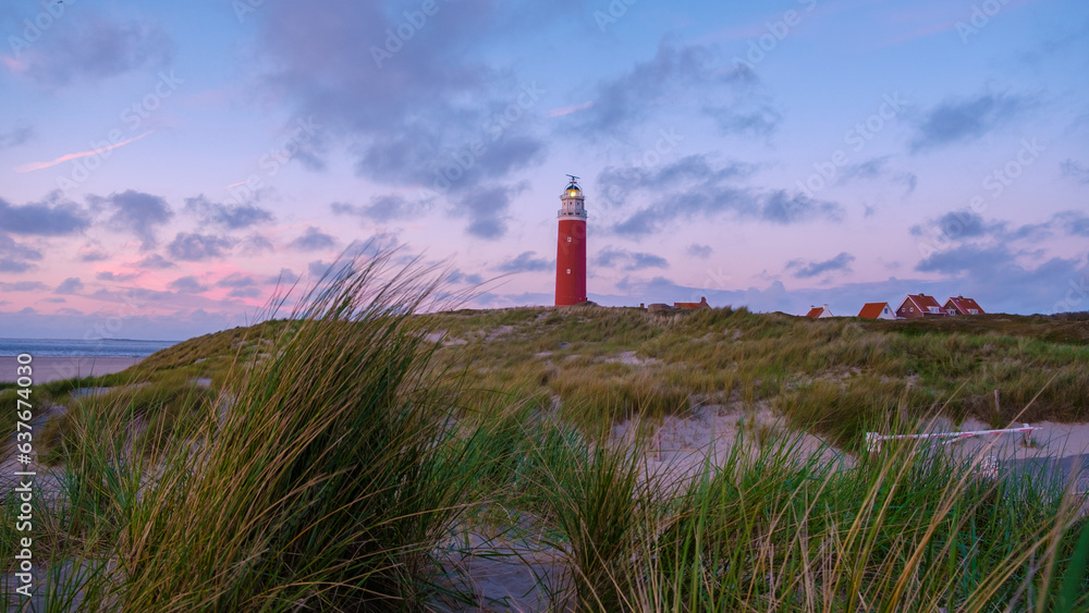 Texell lighthouse during sunset Netherlands Dutch Island Texel in summer with sand dunes at the Wadden Island during dusk