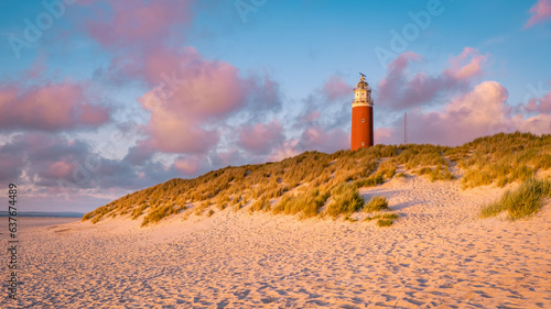 Texell lighthouse during sunset Netherlands Dutch Island Texel in summer with sand dunes at the Wadden Island in the evening