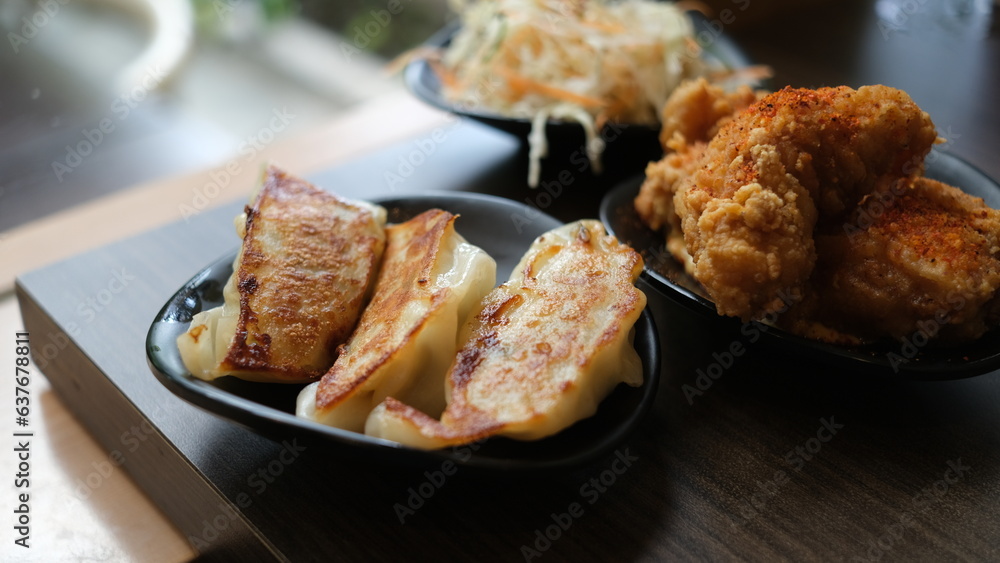 Set menu appetizer of japanese gyoza and chicken karage. Set menu appetizer of japanese gyoza and chicken karage.