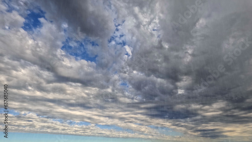 heavy rain on sky with clouds - pretty weather backdrop - photo of nature