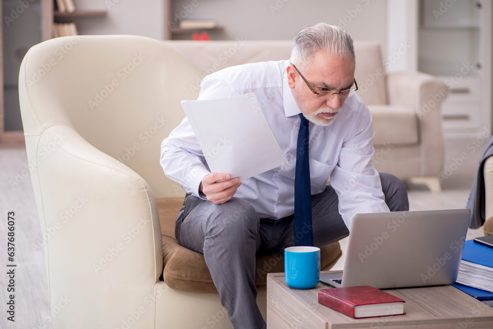 Old male boss working from home during pandemic Old male boss working from home during pandemic