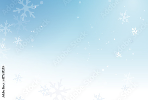 雪の結晶が舞う青色の冬の背景