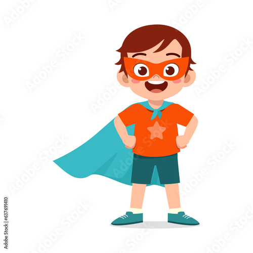 little kid wearing cape and pretending being super hero
