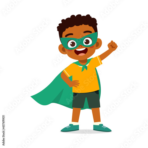 little kid wearing cape and pretending being super hero