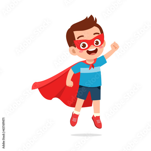 little kid wearing cape and pretending being super hero
