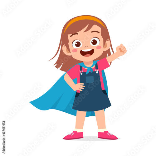 little kid wearing cape and pretending being super hero