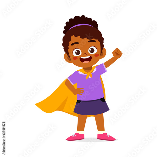 little kid wearing cape and pretending being super hero