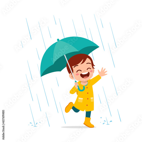 little kid wearing yellow rain coat in the rain and feel happy