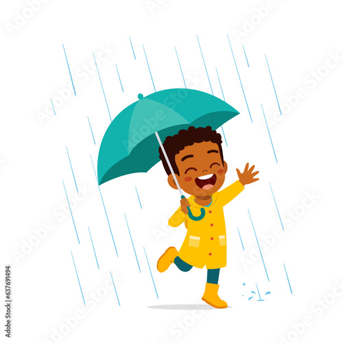 little kid wearing yellow rain coat in the rain and feel happy