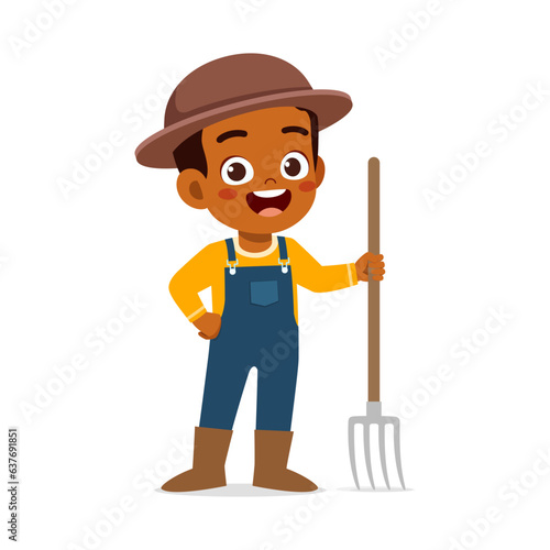 little kid wearing farmer costume and holding pitchfork