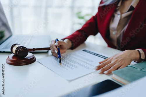 The lawyer with a client discussing contract paper, a Business lawyer working about legal legislation in the courtroom to help their customer, contract and agreement concept.