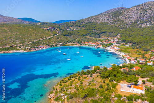 Fototapeta Naklejka Na Ścianę i Meble -  Small fishing village of Posidonio with turquoise blue Aegean sea on Samos island, Greece