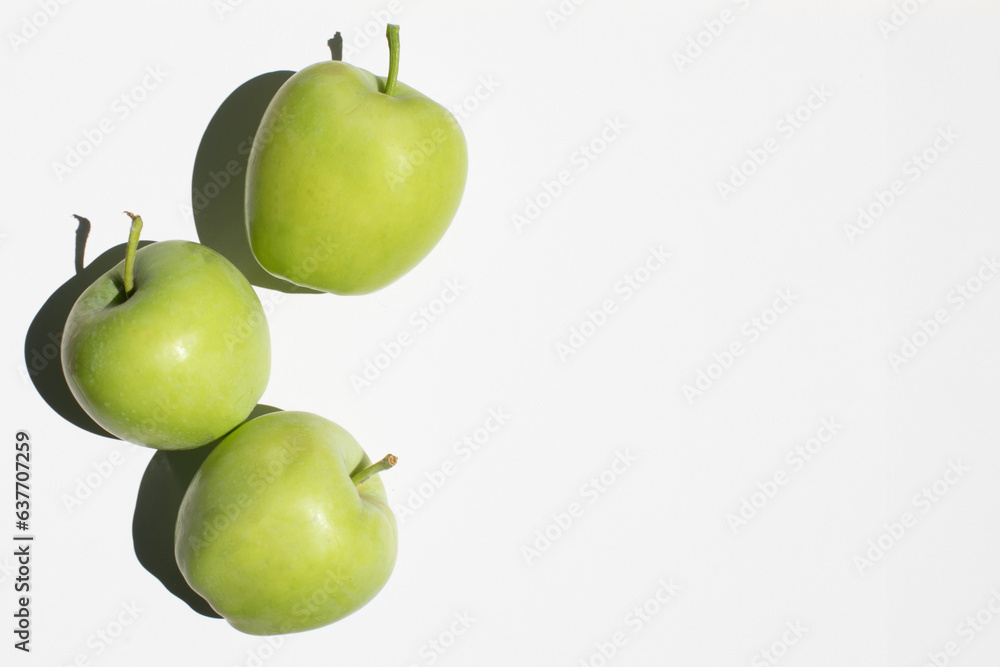 Fresh young green ripe apples isolated on white background top view