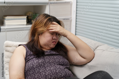 Sad Overweight plus size woman thinking about problems on sofa upset girl feeling lonely and sad from bad relationship or Depressed woman disorder mental health © Charlie's