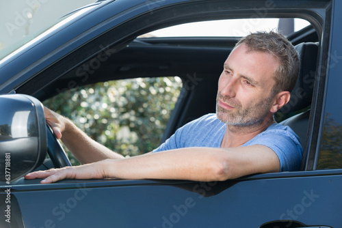 portrait handsome man in his car
