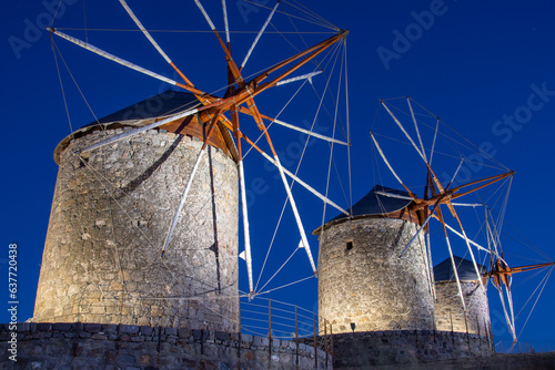 The three windmills of Chora and iconic Monastery of Saint John the Theologian in chora of Patmos island, Dodecanese, Greece