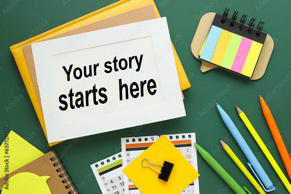 Your Story Starts Here text on white paper in a frame on a green ...