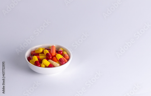 one cup of medicine capsule on white background