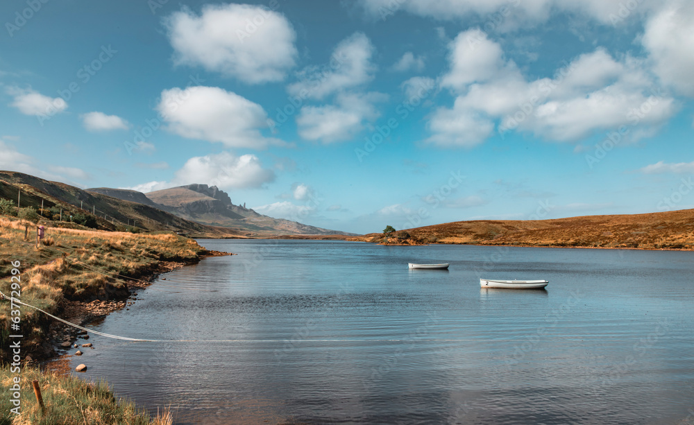 The scenery of the Loch Fada and the Old Man of Storr from distance in sunny days