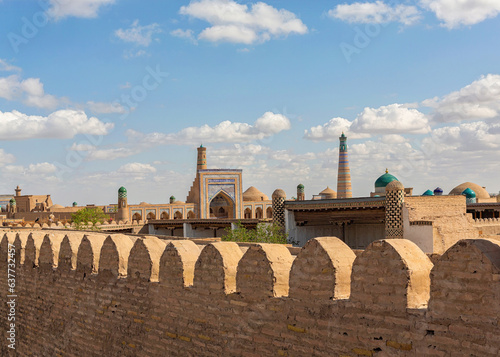 View on ancient Khiva (Xiva) from her defensive wall with clouds at background. Khiva (Xiva), Uzbekistan photo