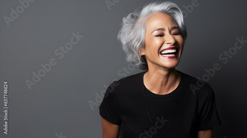 Radiant senior woman laughing in a black tshirt
