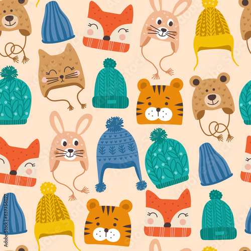 Seamless pattern with cute vector winter hats for boys and girls in cold weather. Clothes for winter and autumn. Vector illustration.
