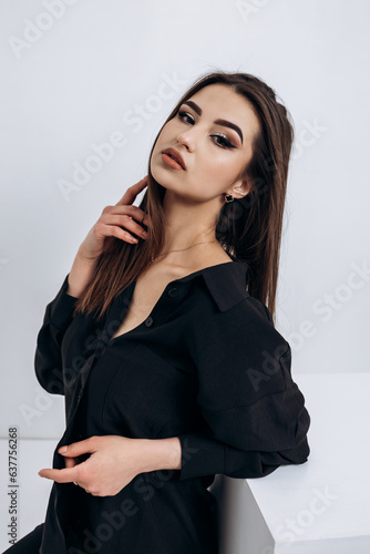 Vertical portrait close up fashion portrait of young pretty indian latin american woman posing in photo studio on white background. Hispanic lady, skin care, solarium, make up, cosmetology 