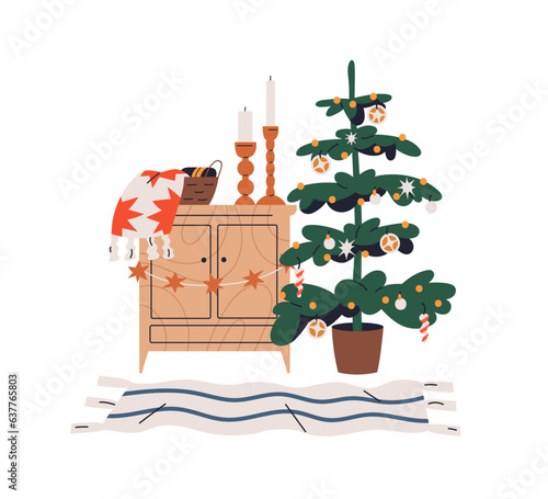 Christmas tree and home decorations. Xmas fir with baubles, candles on cabine...