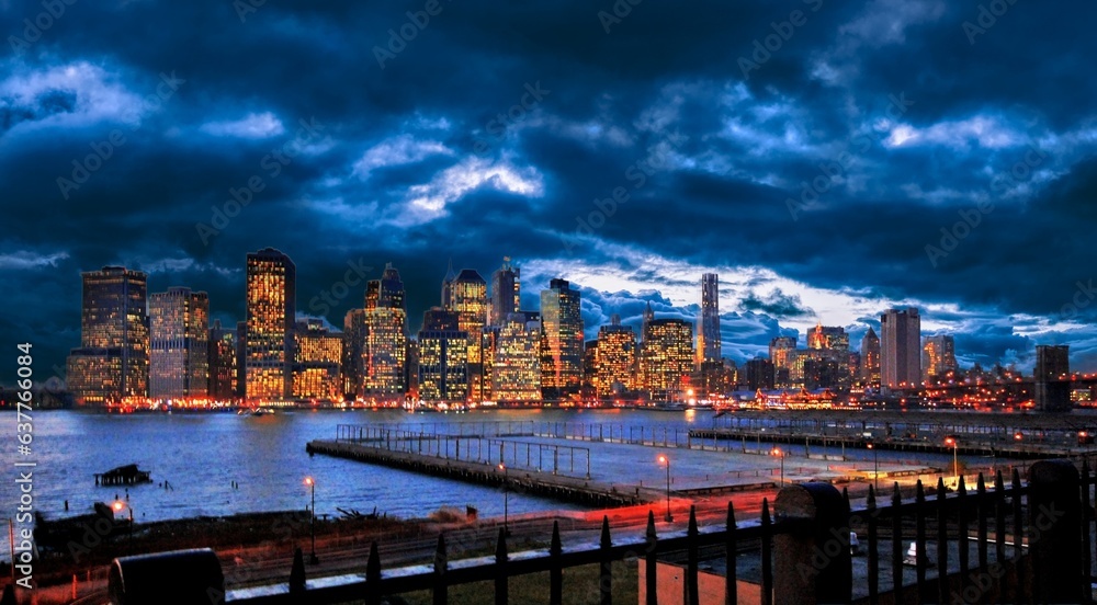 city skyline at dusk with dramatic clouds 