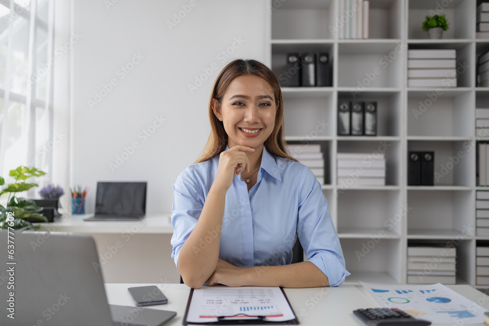 Asian woman working in startup company office, businesswoman checking documents and company performance report to analyze and find ways to grow company. Business administration concept. Asian woman working in startup company office, businesswoman checking documents and company performance report to analyze and find ways to grow company. Business administration concept.