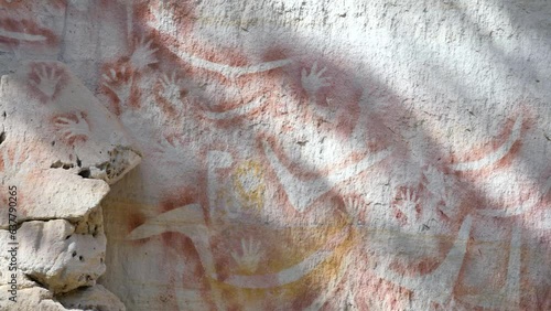 Dreamtimes stories painted on ancient sandstone walls by the Bidjara and Karingbal Aboriginal people of Australia photo