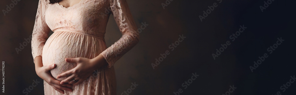 Pregnant woman in dress holds hands on belly on a dark background - obrazy, fototapety, plakaty 