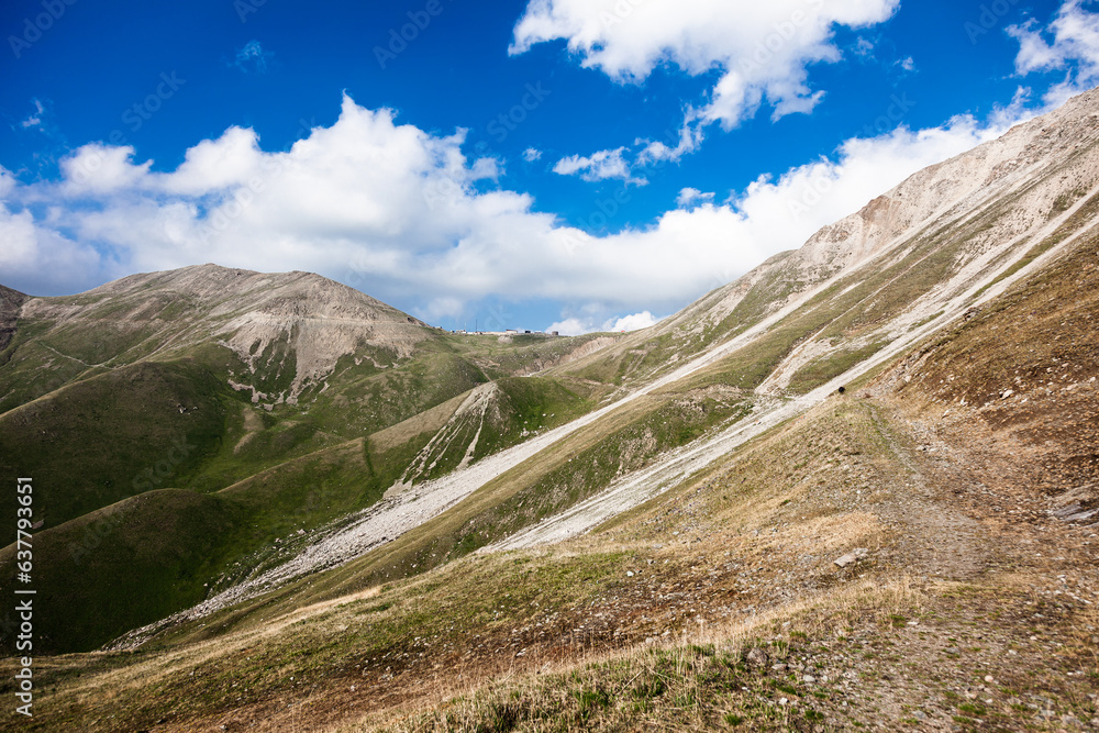 An amazing road leading to the Dzhusaly-Kezen pass at an altitude of 3375 meters