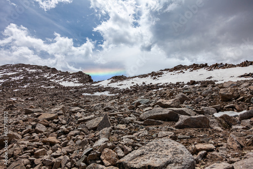Obraz na płótnie An unusual phenomenon high in the mountains appears in the form of a rainbow. Overall plan w salonie