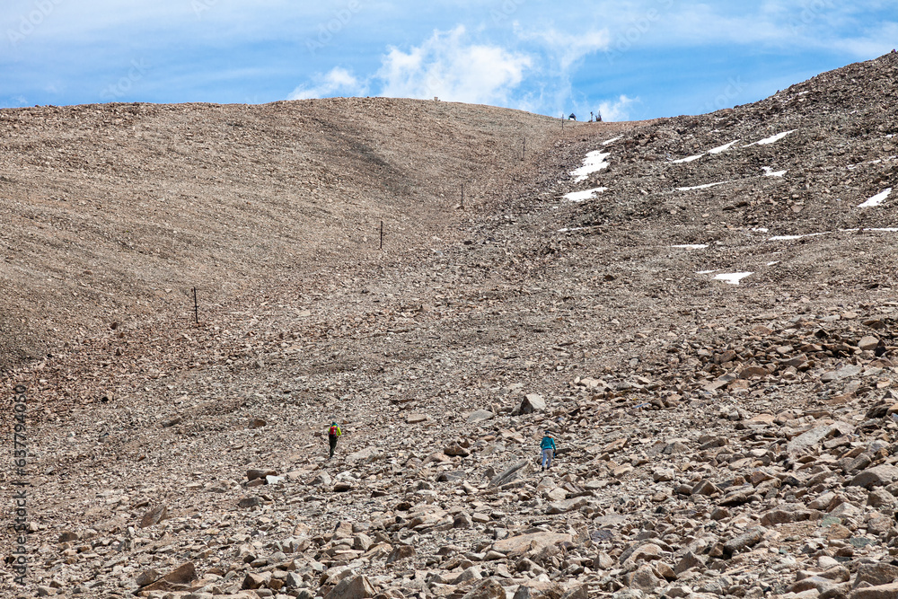 Climbers climb the peak Tourist from the pass Dzhusaly-Kezen
