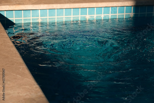 Blue Swimming Pool. Spa corner in the pool. Outdoor Swimming Pool. Swimming pool system.