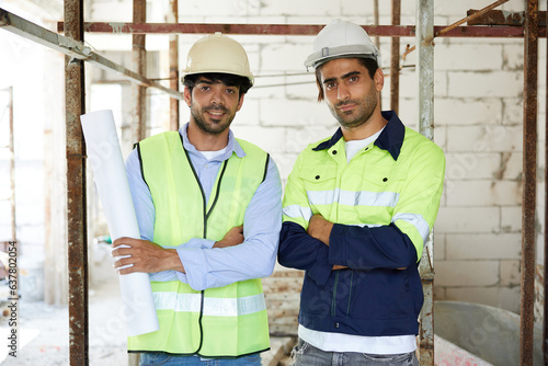 portrait workers or architects holding blueprint paper and crossed arms pose at construction site