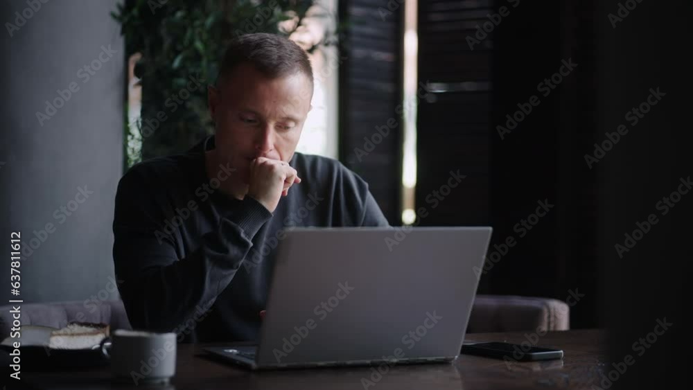 Nervous Businessman With Laptop Sitting In Cafe, Portrait Of Investor Monitoring Cryptocurrency Rate Nervous Businessman With Laptop Sitting In Cafe, Portrait Of Investor Monitoring Cryptocurrency Rate