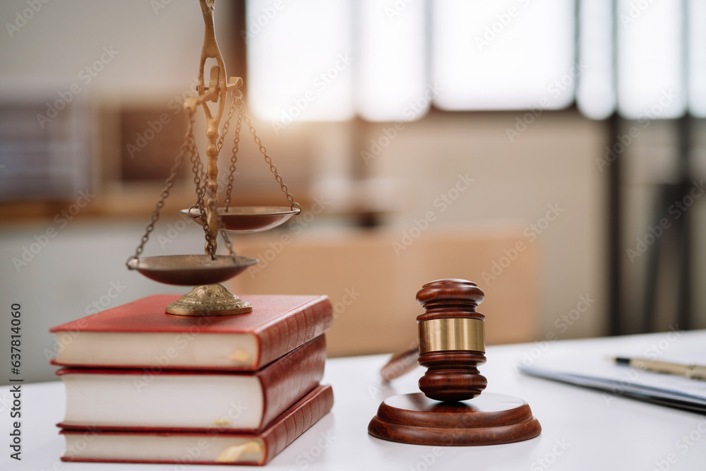 ustice with scales and auction hammer, the team meeting at the law firm behind the concept of in office law. ustice with scales and auction hammer, the team meeting at the law firm behind the concept of in office law.