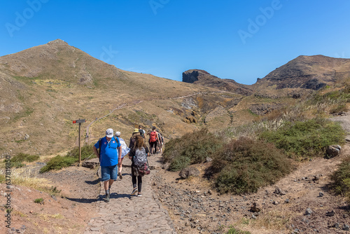 Panoramic view of a group of tourists hiking in St. Lourenço Cape or Cabo de São Lourenço, on Madeira Island, Portugal