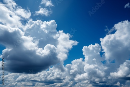 A clear blue sky with fluffy white clouds