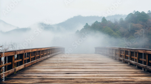 Decayed old wooden bridge in a rural village humidity of the air there is a white fog in the morning.