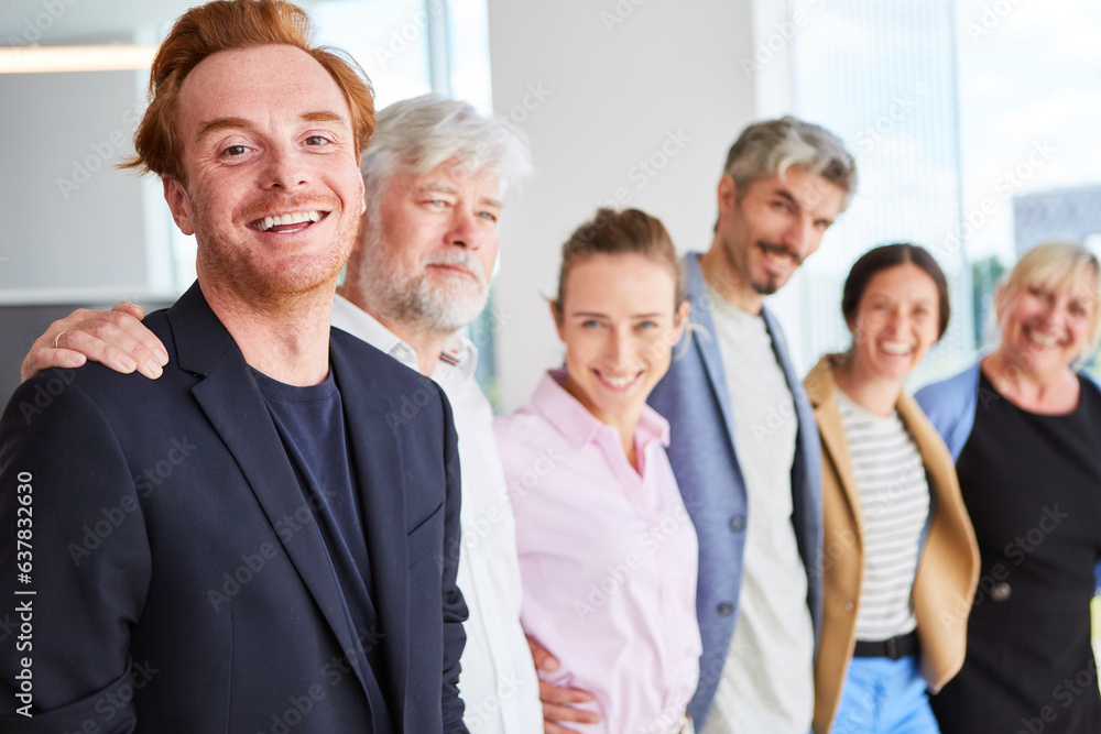 Portrait of smiling male and female business colleagues standing side to side at office Portrait of smiling male and female business colleagues standing side to side at office