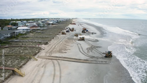 Bulldozers Pushing Sand on Beach in Beach Erosion Restoration Project from 4K Aerial Drone photo