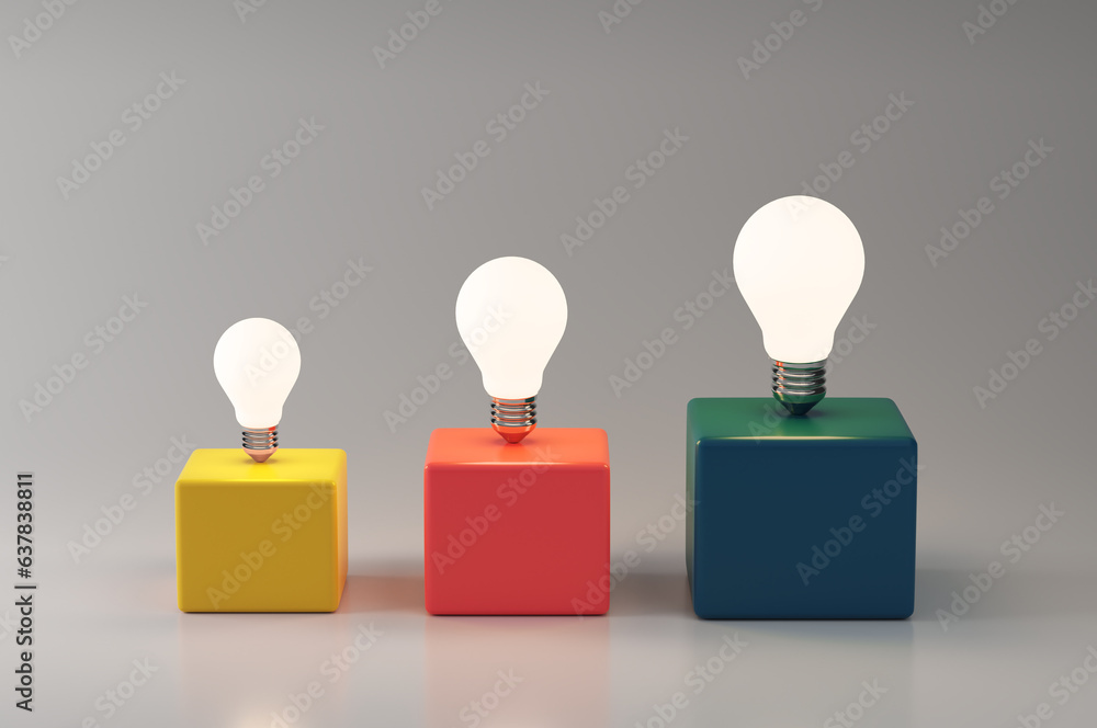 Illuminated light bulbs on colorful cubes. Creative idea development. Creative thinking, innovation and brainstorming. Illuminated light bulbs on colorful cubes. Creative idea development. Creative thinking, innovation and brainstorming.