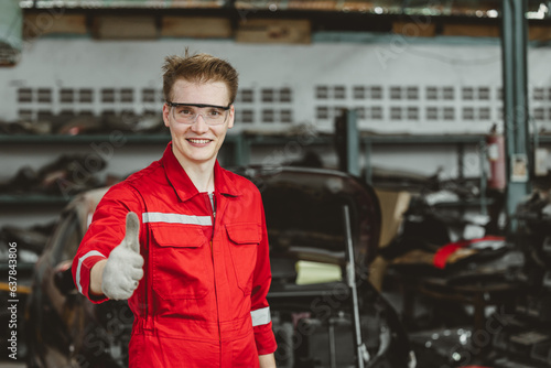 portrait thumbs up happy garage mechanic male worker working fix service maintenance auto vehicle engine