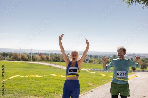Photography high level runners in a marathon - people who compete in fitness and healthy active lifestyle on the road
