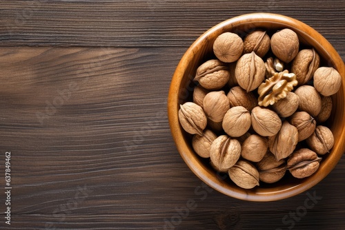 Top view of walnuts in a bowl on rustic table  healthy food. Generative Ai.