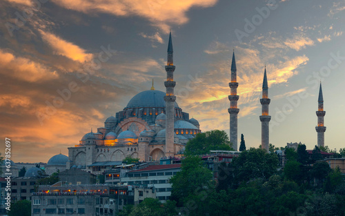 Beautiful view of gorgeous historical Suleymaniye Mosque, Rustem Pasa Mosque and buildings in front of dramatic sunset. Istanbul most popular tourism destination of Turkey