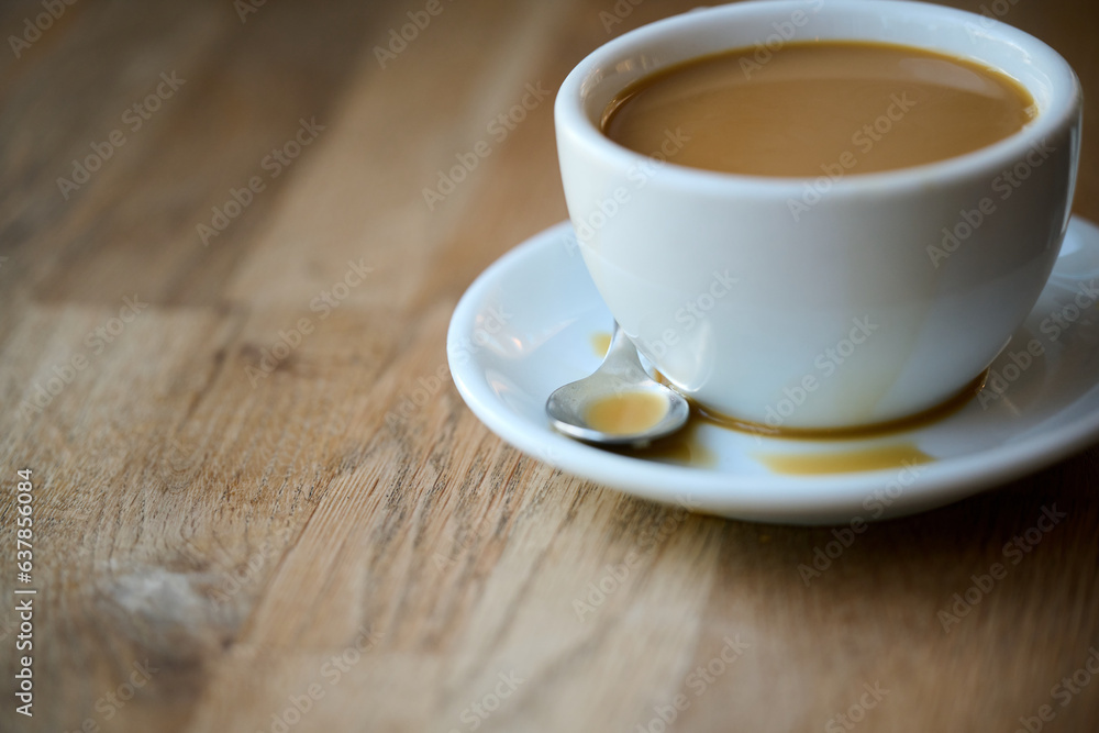cup of coffee with milk on wooden table cup of coffee with milk on wooden table